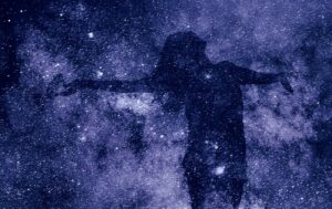 a silhouette of a woman against a purple starry background, representing advaita