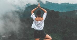 Woman practicing yoga representing the five niyamas of yoga philosophy