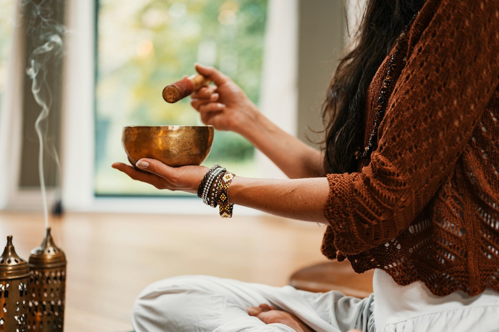 Person in seated meditation pose practicing mindfulness for anxiety relief