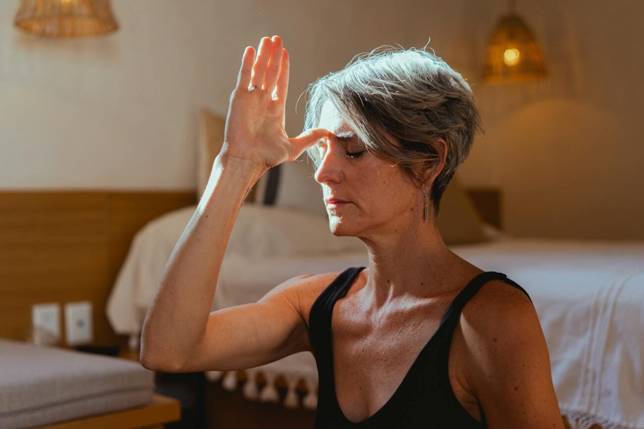 Older woman seated in calm meditation symbolising yoga's role in Alzheimer's biomarker reduction