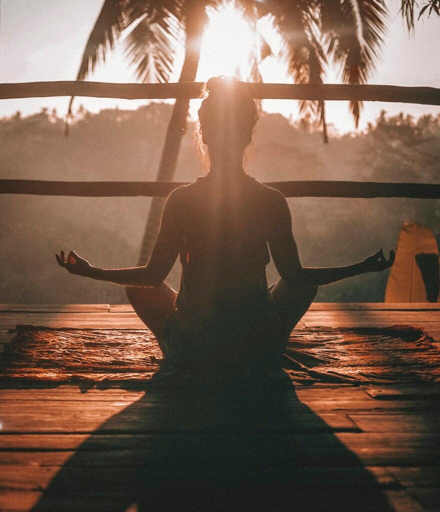 Woman practicing seated yoga breathing with eyes closed to support eye health