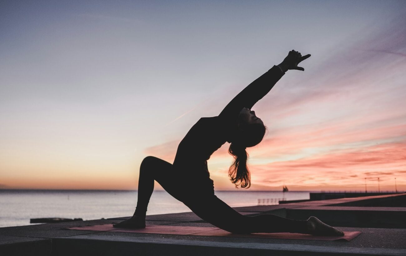 Woman practicing yoga in a calm studio, illustrating research on yoga and inflammation-related gene expression