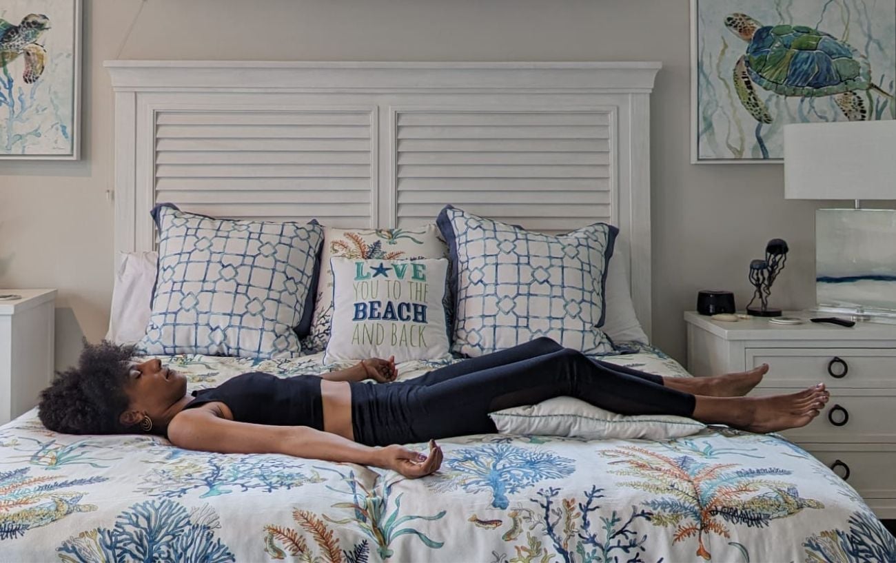 Woman resting in savasana as yoga-based therapy shown to match CBT for chronic insomnia